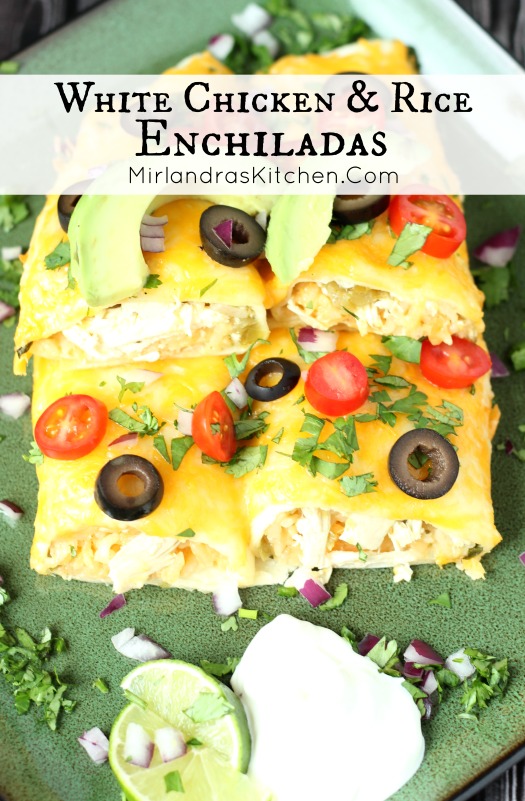 A green plate has four enchiladas stacked on it. They are garnished with olives, tomatoes and cilantro. 