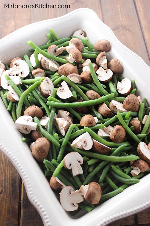 This updated version of gluten free green bean casserole is full of mushrooms, caramelized onions, and creamy cheese. Classic flavors reimagined make for a fun new holiday treat. 